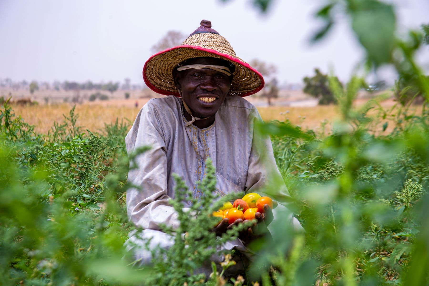 A Nigerian farmer with freshly harvested produce