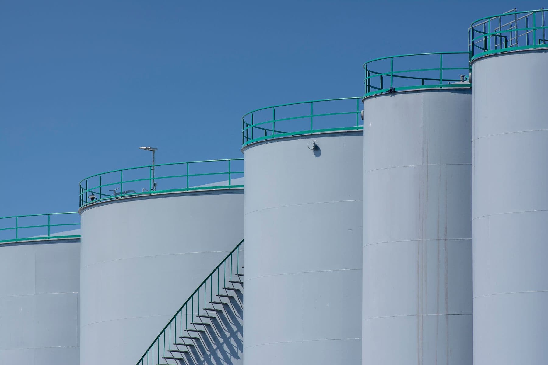 Industrial storage tanks representative of digester infrastructure